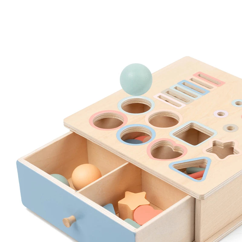 Montessori discovery cube showing sorting shapes