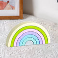 Wooden rainbow stacker used as bridge and tunnel