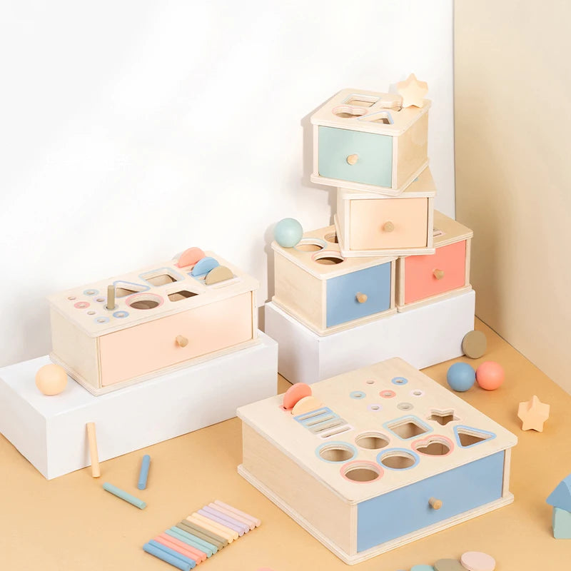 Wooden sensory cube with coin slot and marble track